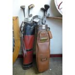 Two sets of vintage Spalding golf clubs, with bags