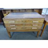An early 20th Century oak and beech three drawer plan chest