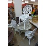 A cast alloy garden table and four chairs