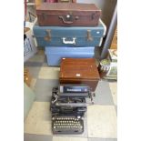 A vintage Remington typewriter, two cases and a wooden box