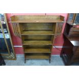 An Arts and Crafts oak open bookcase