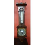 A Victorian carved walnut aneroid barometer, the silvered dial signed J. Hicks, London