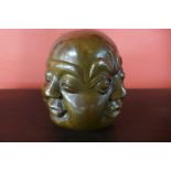 An oriental bronze four faced Buddha