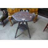 An eastern carved wood occasional table