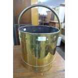 An Arts and Crafts brass coal bucket