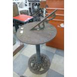 A cast iron garden sun dial