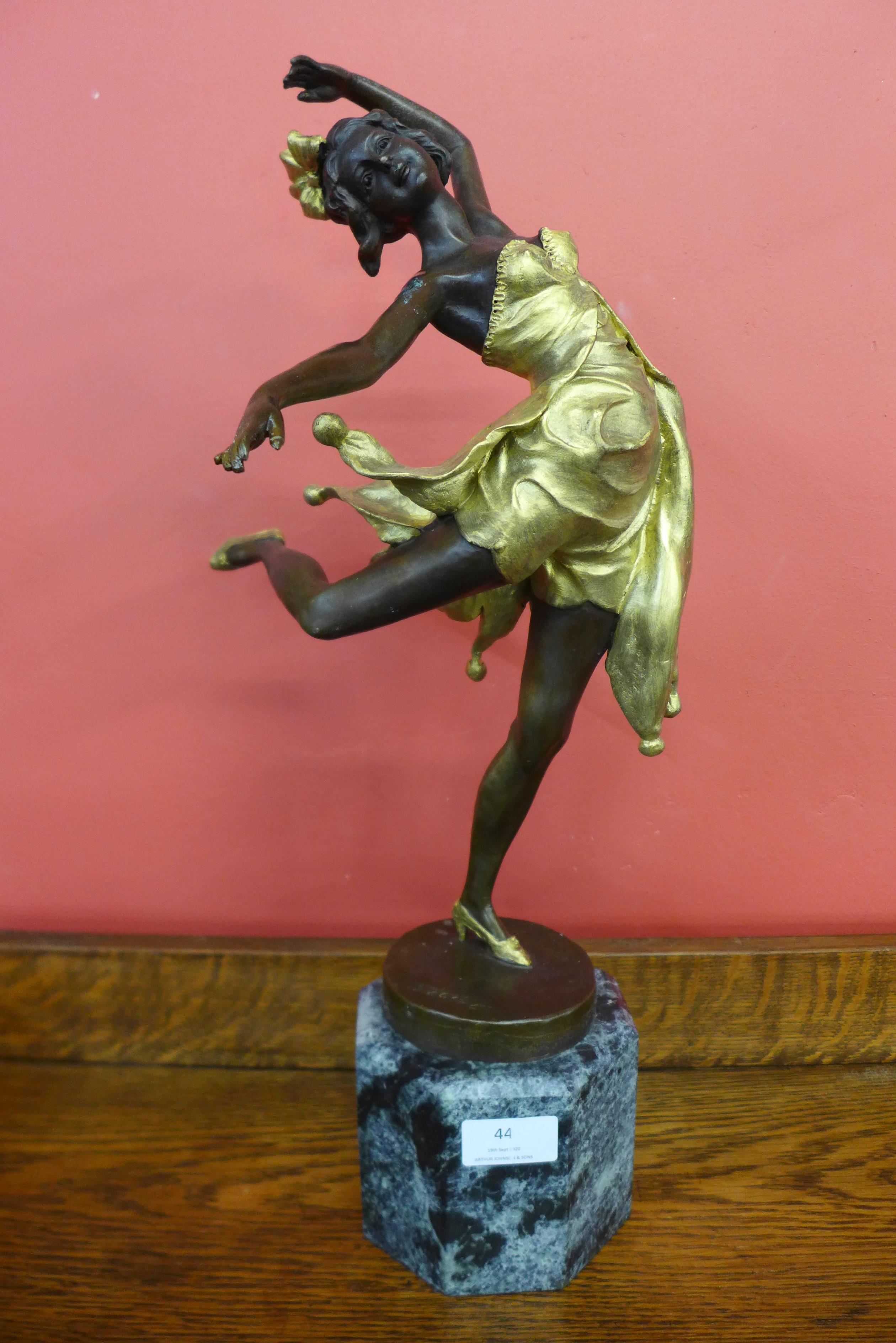 An Art Deco style gilt bronze figure of a female dancer, on green marble socle