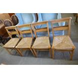 A set of four beech rush seated chapel chairs