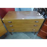 A teak chest of drawers