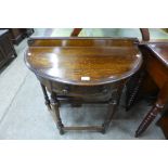 A carved oak single drawer demi-lune hall table