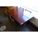 A Scandarf teak extending dining table and four chairs