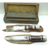 Two Chinese knives with scabbards and a blade sharpening block