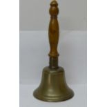 A brass bell, lacking clacker