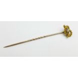 A 15ct gold and diamond stick pin, in fitted case