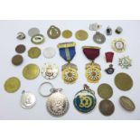 A collection of badges, medallions, etc.