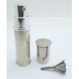 A silver perfume atomiser holder and a funnel