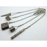 A late Victorian silver chatelaine, clip and pencil with London marks, the four other attachments