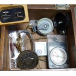 A wooden box and contents including two compasses, etc.