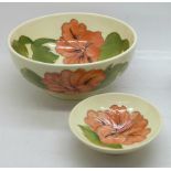 A Moorcroft bowl, 16cm diameter, and a pin dish in the Coral Hibiscus pattern on cream ground