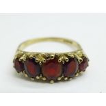 A 9ct gold and garnet ring, 2.8g, N