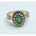 A 9ct gold, emerald and diamond cluster ring, 2.8g, J