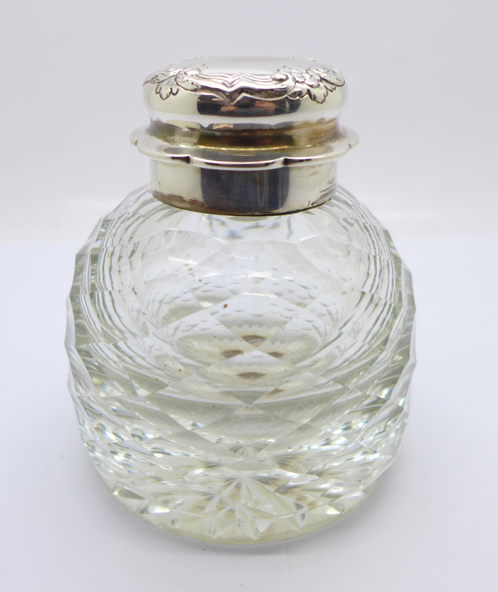 A heavy silver topped glass jar, London 1899