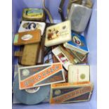An altimeter, slide rule, three surveyor's tapes, compass, tie-press, tins, two Rolls Razors, one