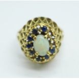 A 14k gold, sapphire and opal set ring, lacking two sapphires, 5.1g, O