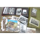 A postcard album, postcards and a photograph album