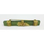 A 9ct gold mounted jade brooch, with New Zealand fern, 51mm