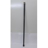 An ebonised walking cane with silver top