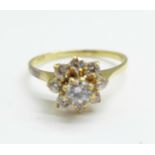 A yellow metal and white stone cluster ring, tests as 9ct gold, 2g, N