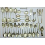 A large collection of silver spoons, a pair of sugar bows, a pepper and a fruit knife, 720g