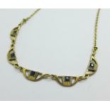 A yellow metal, Arts and Crafts blue stone set necklet, tests as 18ct gold, 5.5g, 43cm