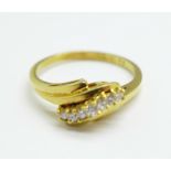 An 18ct gold seven stone diamond ring, 3.1g, M