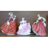 Two Royal Doulton figures, Autumn Breezes and Fair Lady (Red), and a Leonardo Collection figure