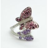 A 9ct white gold, diamond, ruby and amethyst cocktail ring, approximately 66 'gems', 5.9g, O