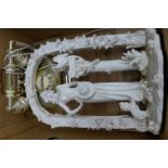 A large figure in a rose covered arch and a faux onyx telephone **PLEASE NOTE THIS LOT IS NOT