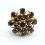 A 14k gold and garnet cluster ring, 5.7g, Q