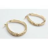 A pair of silver gilt hoop earrings