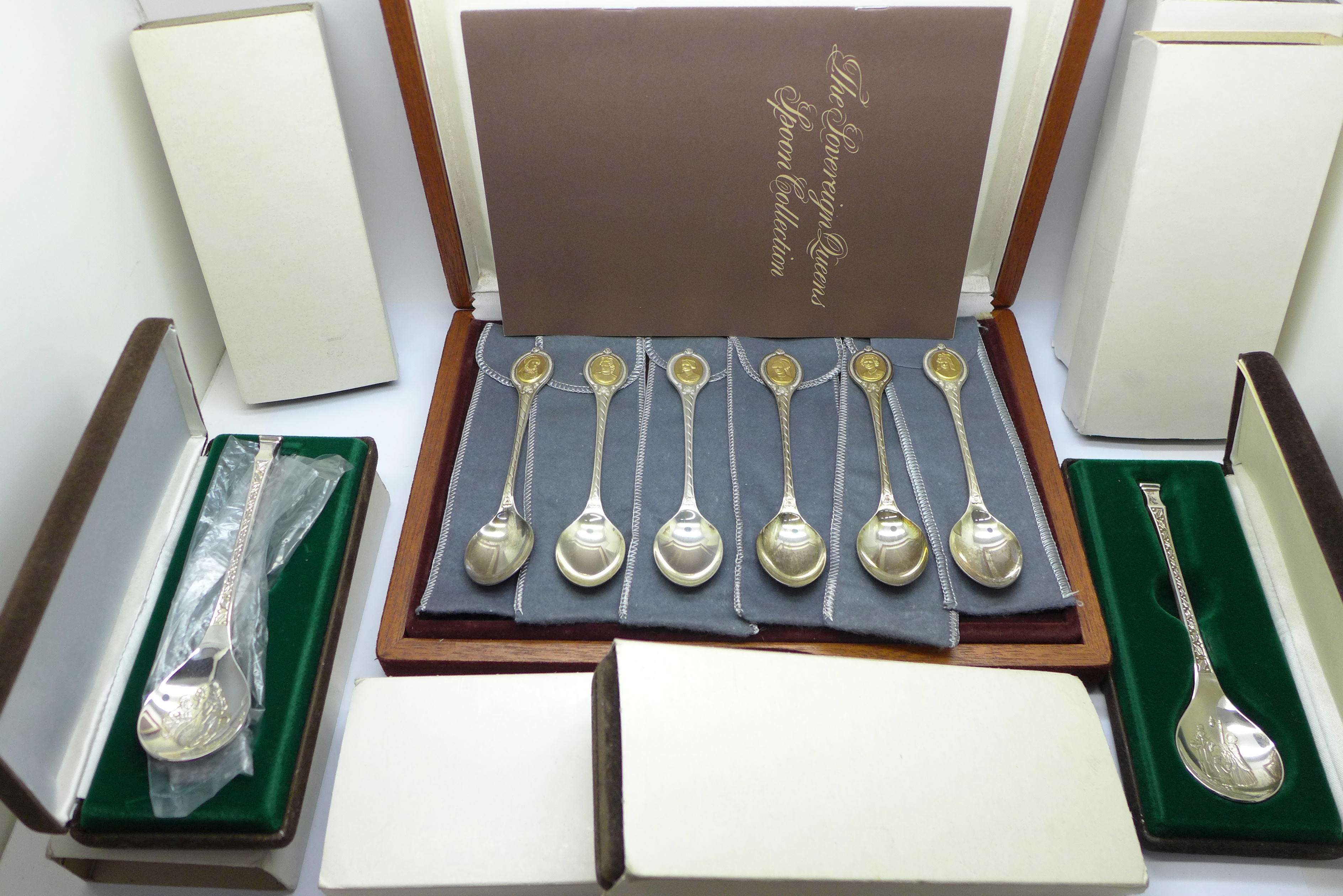 The Sovereign Queens Spoon Collection, cased set of six silver spoons with cameos plated in 24ct