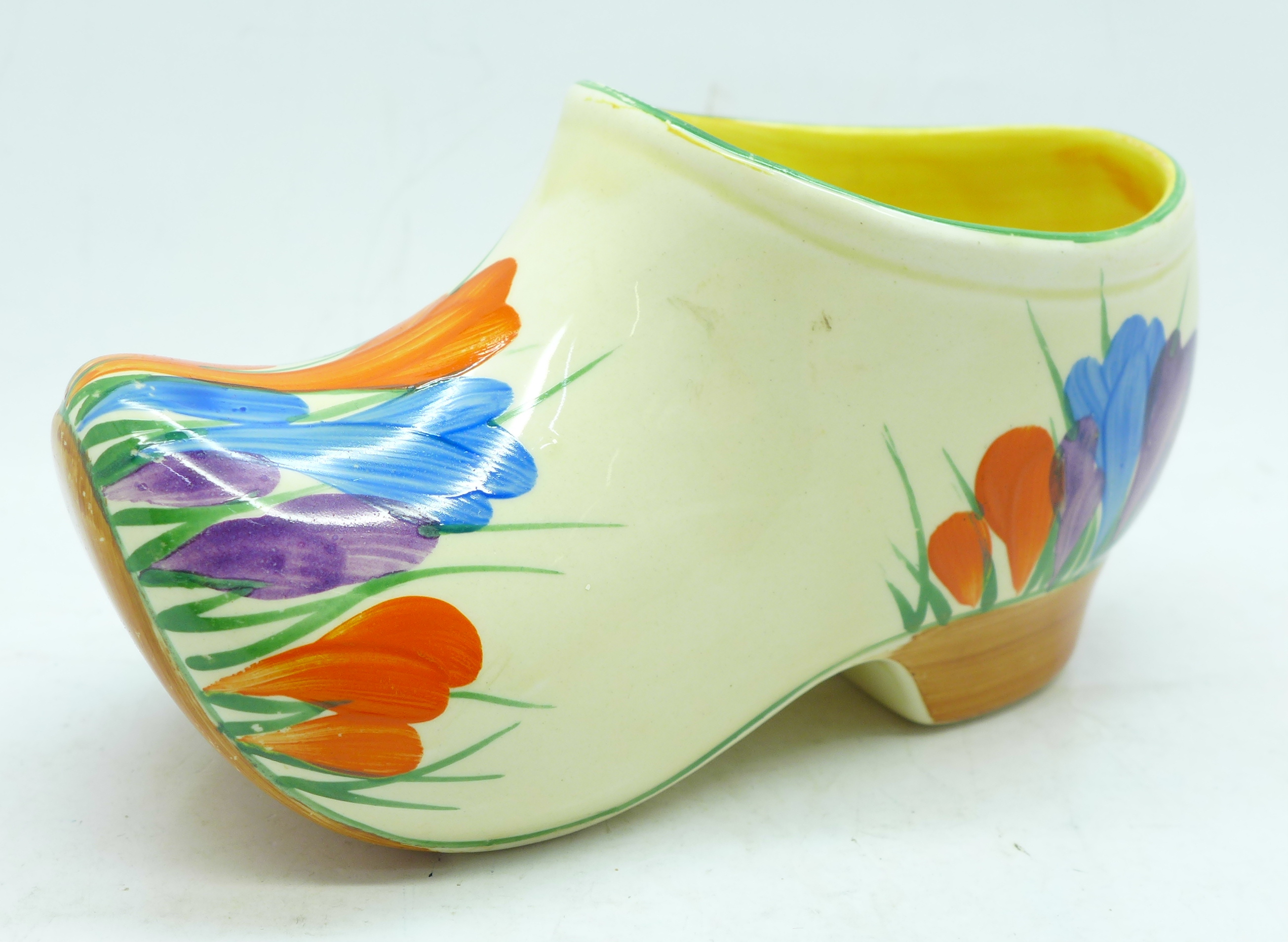 A Clarice Cliff Bizarre Crocus clog, small hairline to the rim, 14cm