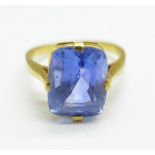 A yellow metal, blue stone ring, (tests as 18ct gold), 4.9g, N, stone approximately 9mm x 11mm