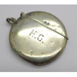 A silver vesta case