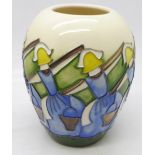 A Moorcroft vase decorated in the Eight Maids a Milking pattern from the Twelve Days of Christmas