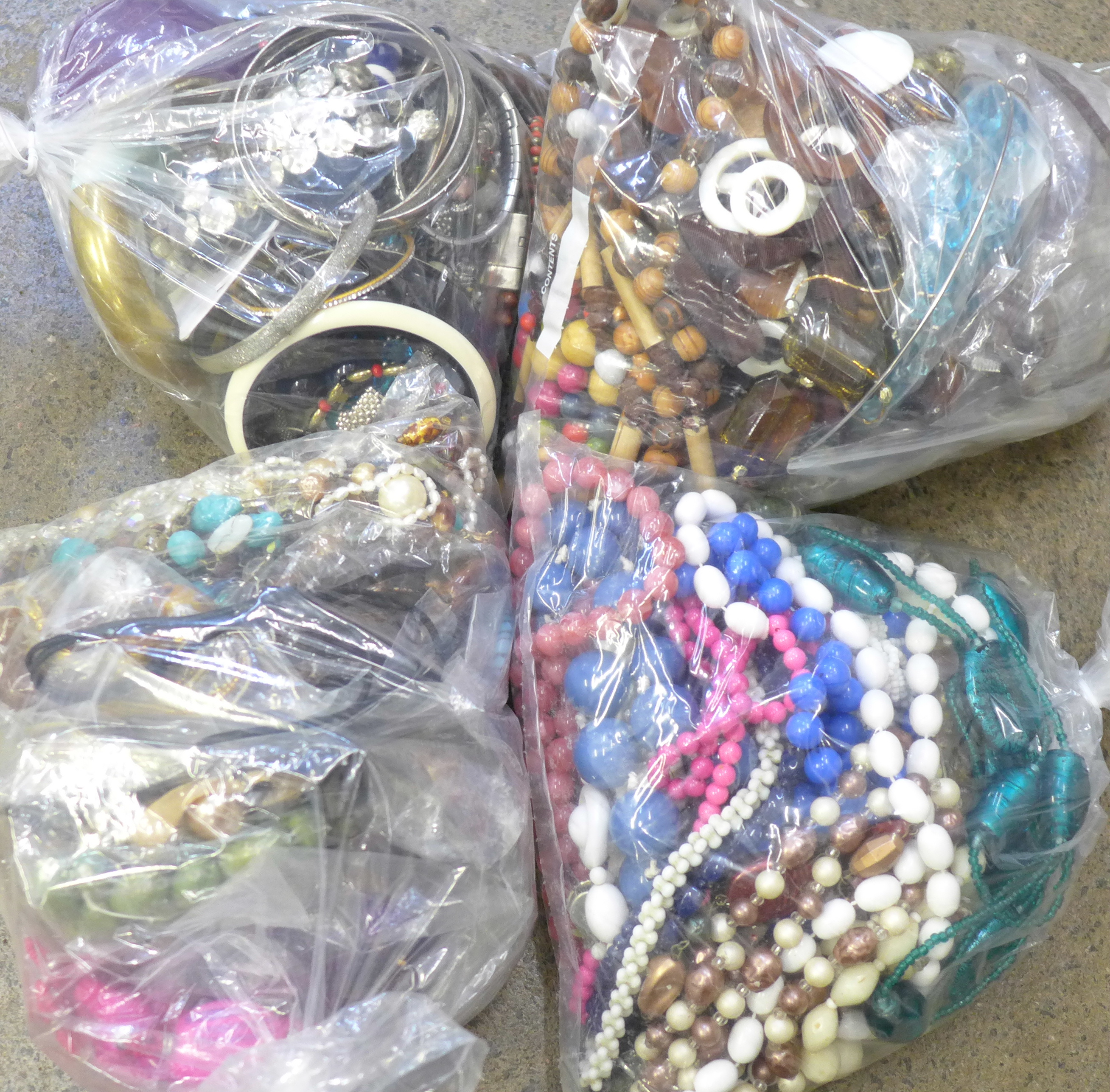 Four bags of costume jewellery and bangles