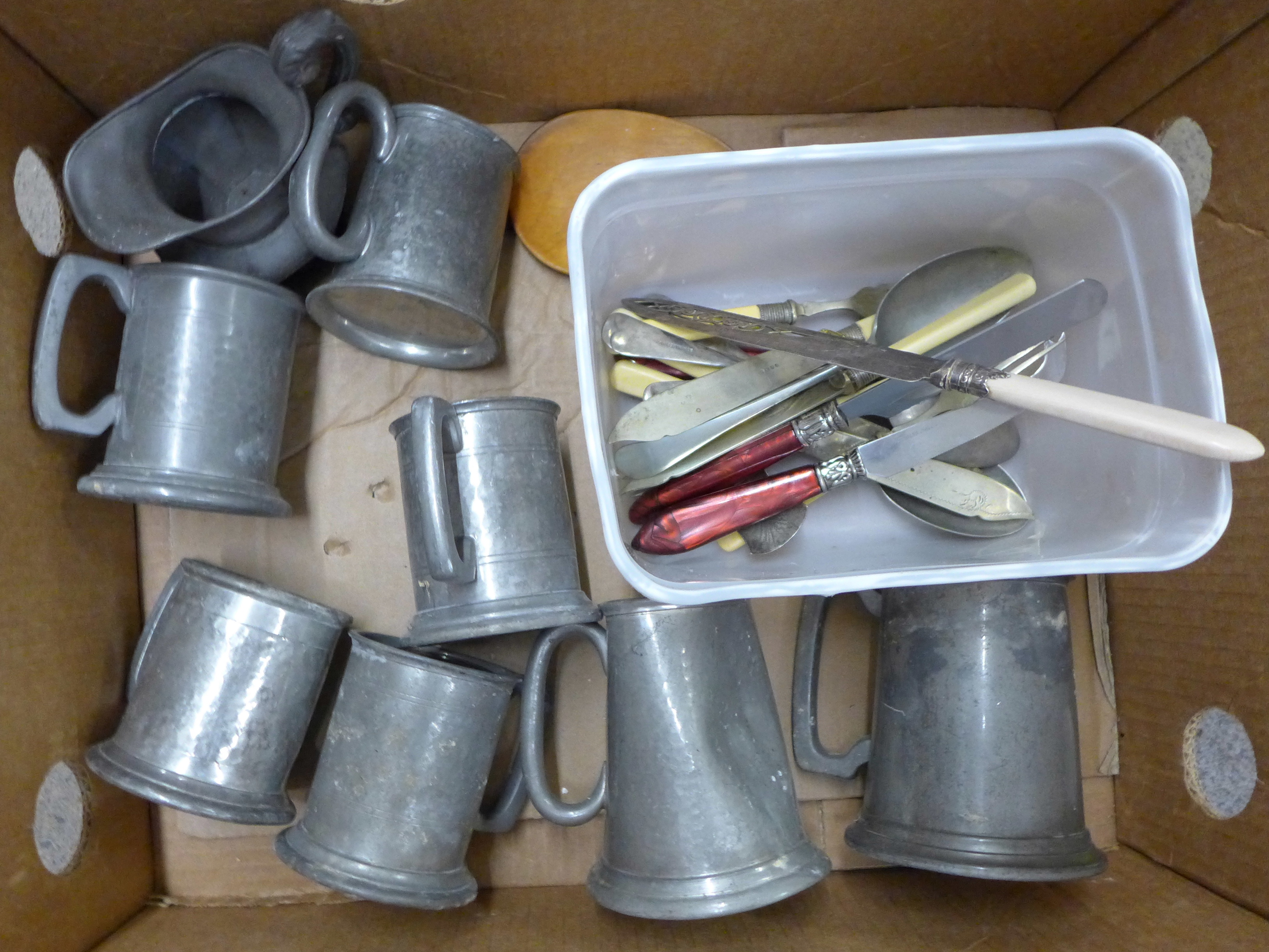 A collection of pewter tankards including English and one marked TP Arkim of Sheffield and flatware,