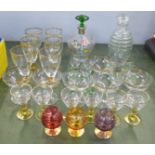 Six champagne coupes, six wine and six liqueur glasses, a 1950's painted decanter with six