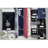 A collection of silver jewellery including abalone and green stones