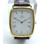 An Omega DeVille wristwatch with Omega strap and buckle, 26mm case
